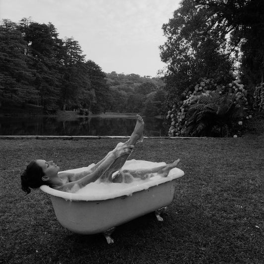 Body Way Vintage Bathtub — fine art photograph of a woman bathing in a vintage tub in the Brazilian landscape by Marcus Luconi.