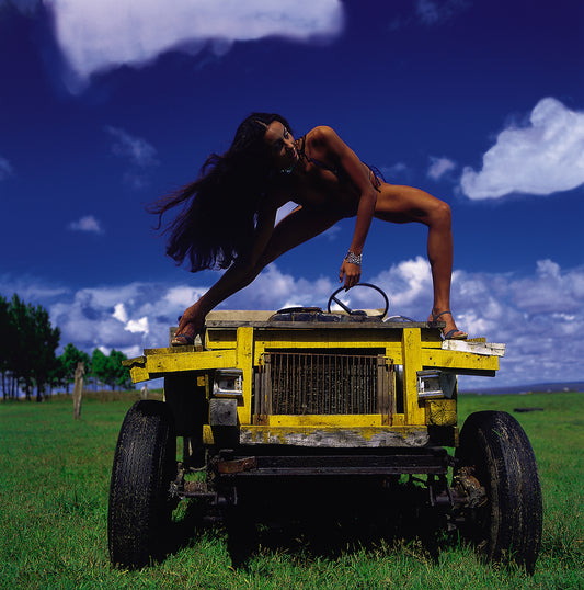 Artwork Title: Model on the Yellow Machine 100 x 100 cm
Series: Wooden Machines & Models
Artist: Marcus Luconi
Year of Capture: 2001
Location: Mostardas, Rio Grande do Sul, Brazil
Original Medium: Fuji Velvia 50 ISO color transparency film
Camera: Analog medium format camera, including Hasselblad 503 CW
Print: Fine art archival pigment print
Edition: [número da edição]