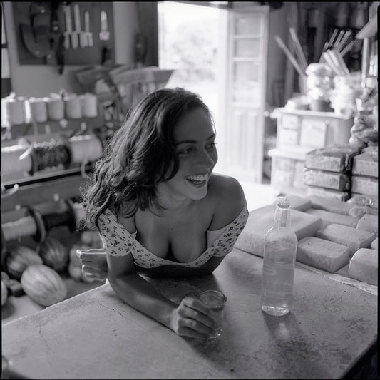 Boteco, Bar and Cachaça No. 03 — woman smiling in a traditional rural Brazilian bar, Body Way fine art photograph by Marcus Luconi.