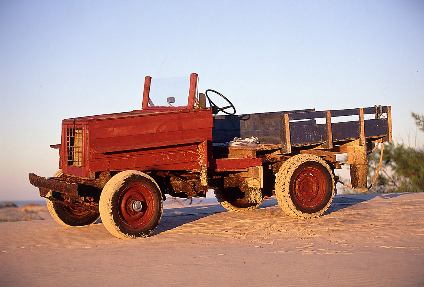 Wooden Machines presents fine art photographs of wooden vehicles created by artisanal fishermen in Mostardas, on the southern coast of Brazil. Photographed on Fuji Velvia 50 ISO film in 2001, these functional machines reveal ingenuity, sculptural beauty and a distinctive presence for architecture and interior design spaces.