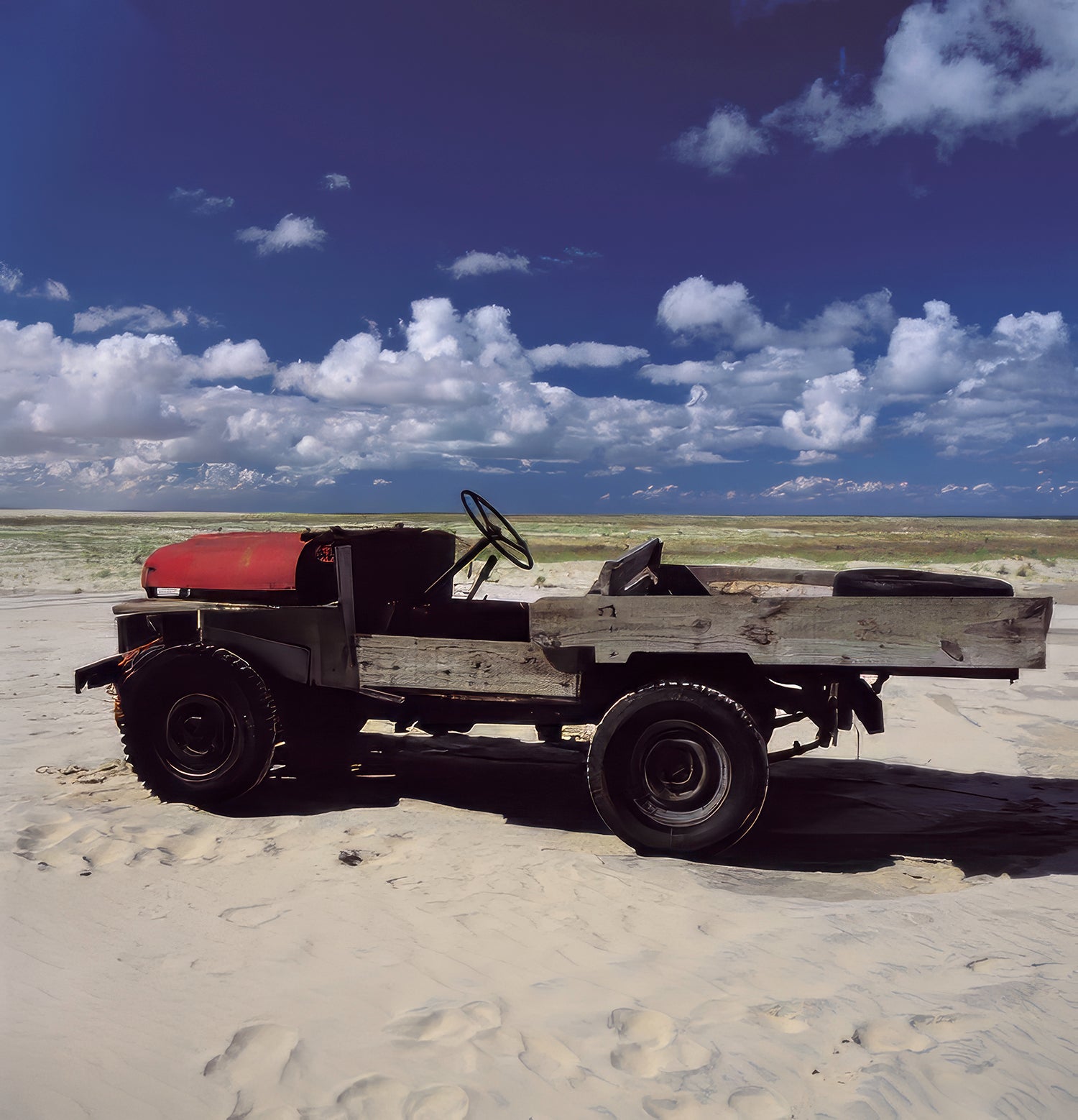 Photographed in April 2001 on the coast of Mostardas, Rio Grande do Sul, Brazil, these images reveal extraordinary vehicles created by local artisanal fishermen to confront the sea, sand and corrosive salt air.

Old four-wheel-drive vehicles had their original metal bodies replaced by wooden structures, adapted for the demanding daily work of pulling heavy fishing nets from the ocean. Built outdoors with necessity, experience and remarkable ingenuity, these machines possess a singular beauty: functional obj